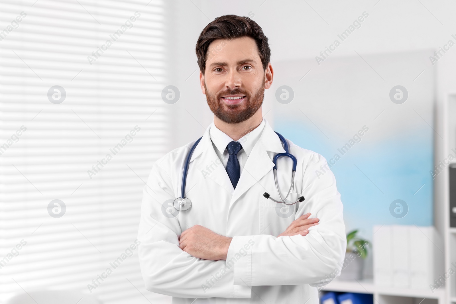 Photo of Portrait of medical consultant with stethoscope in clinic