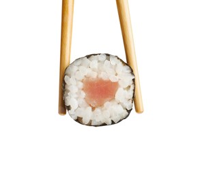 Photo of Chopsticks with tasty fresh sushi roll isolated on white