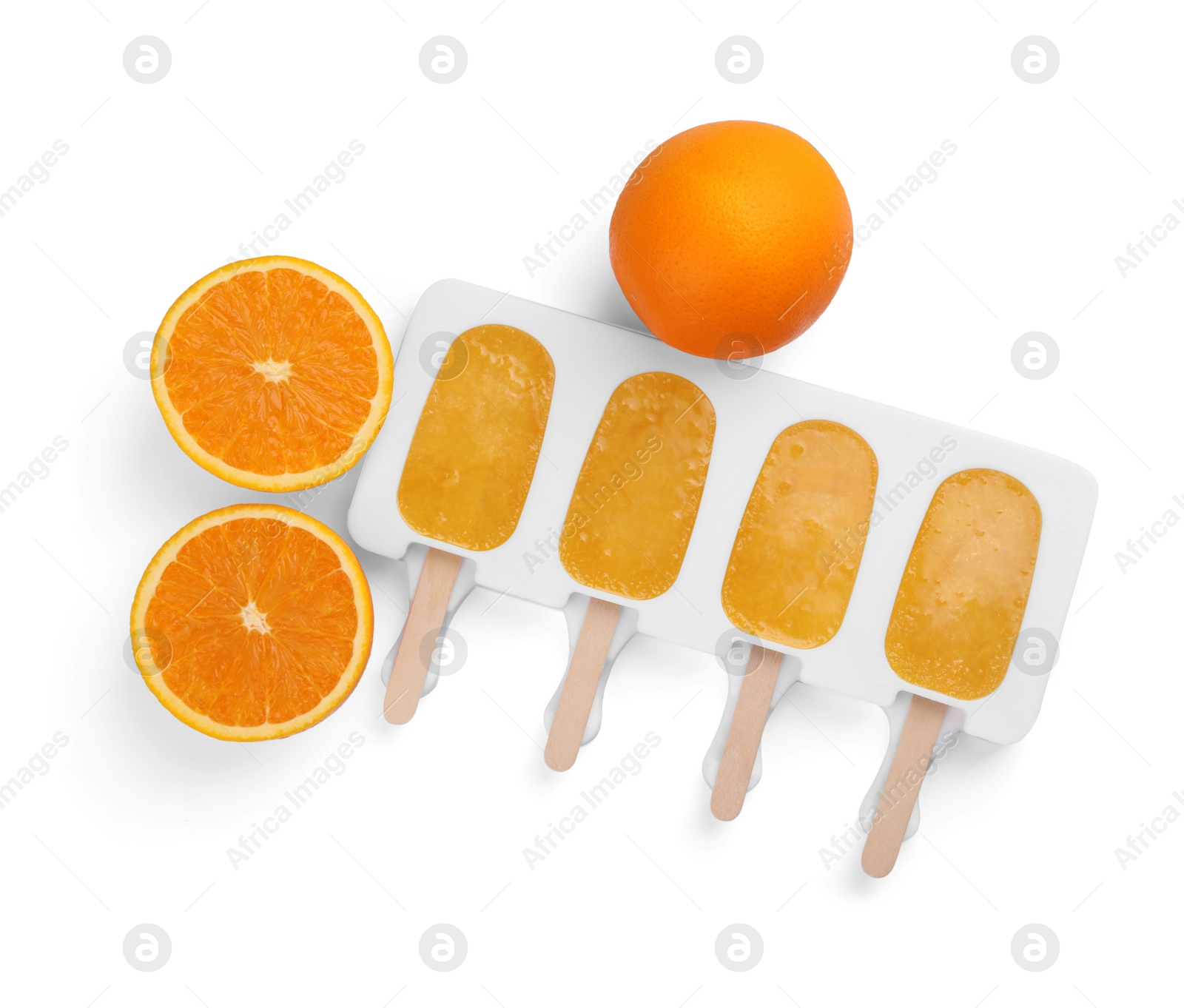 Photo of Tasty orange ice pops in mold isolated on white, top view. Fruit popsicle