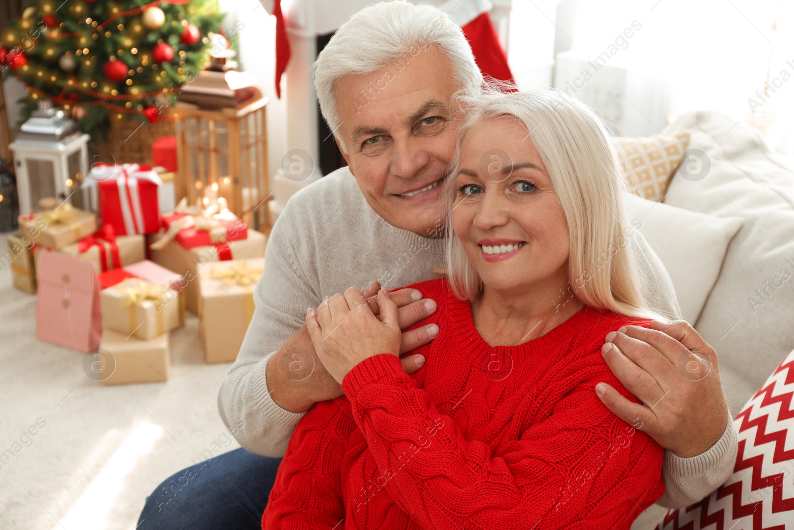 Photo of Happy mature couple at home. Christmas celebration