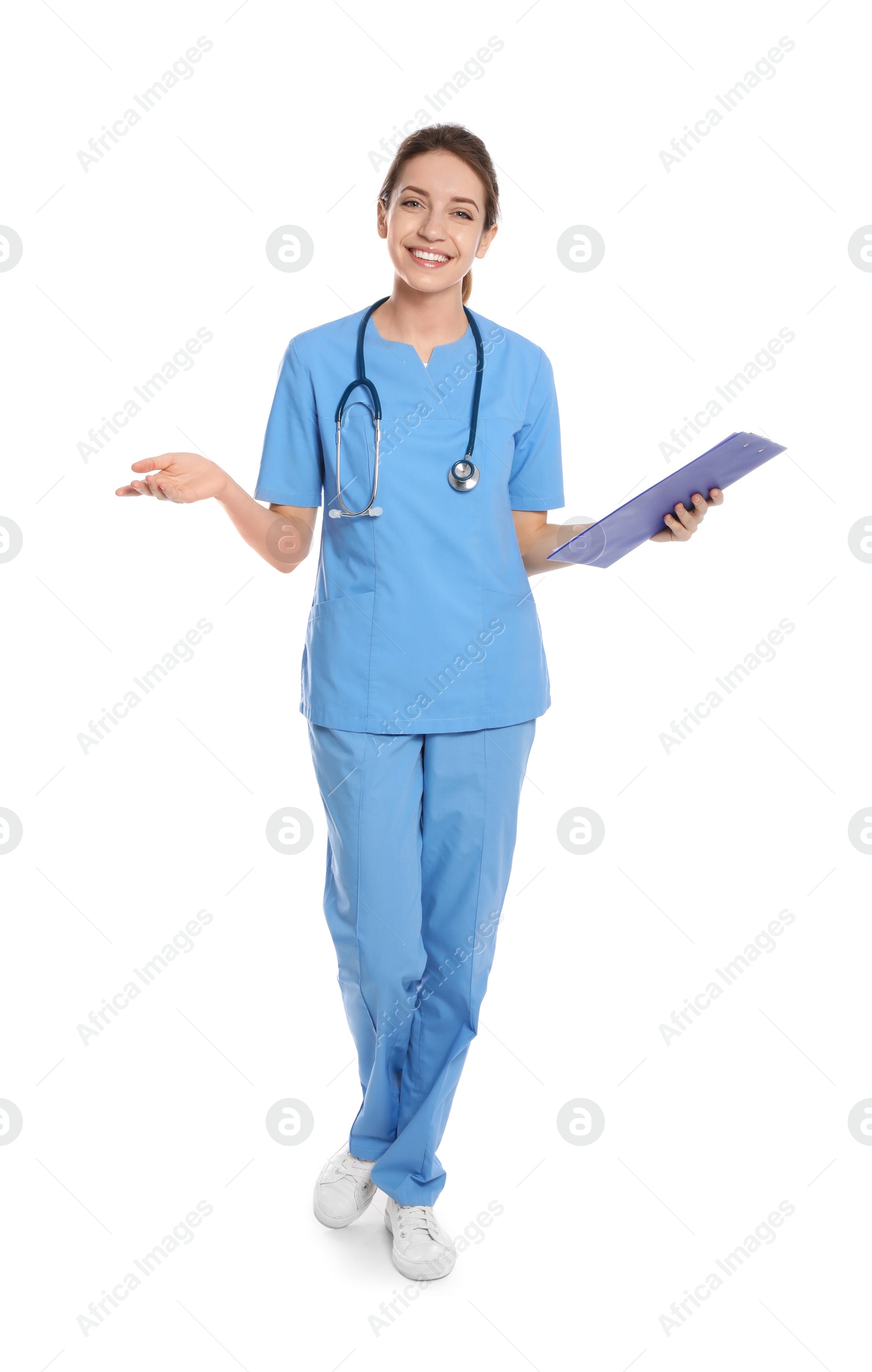 Photo of Full length portrait of medical doctor with clipboard and stethoscope isolated on white