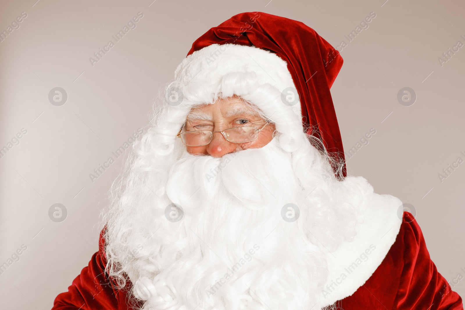 Photo of Happy authentic Santa Claus on grey background