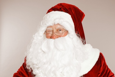 Photo of Happy authentic Santa Claus on grey background