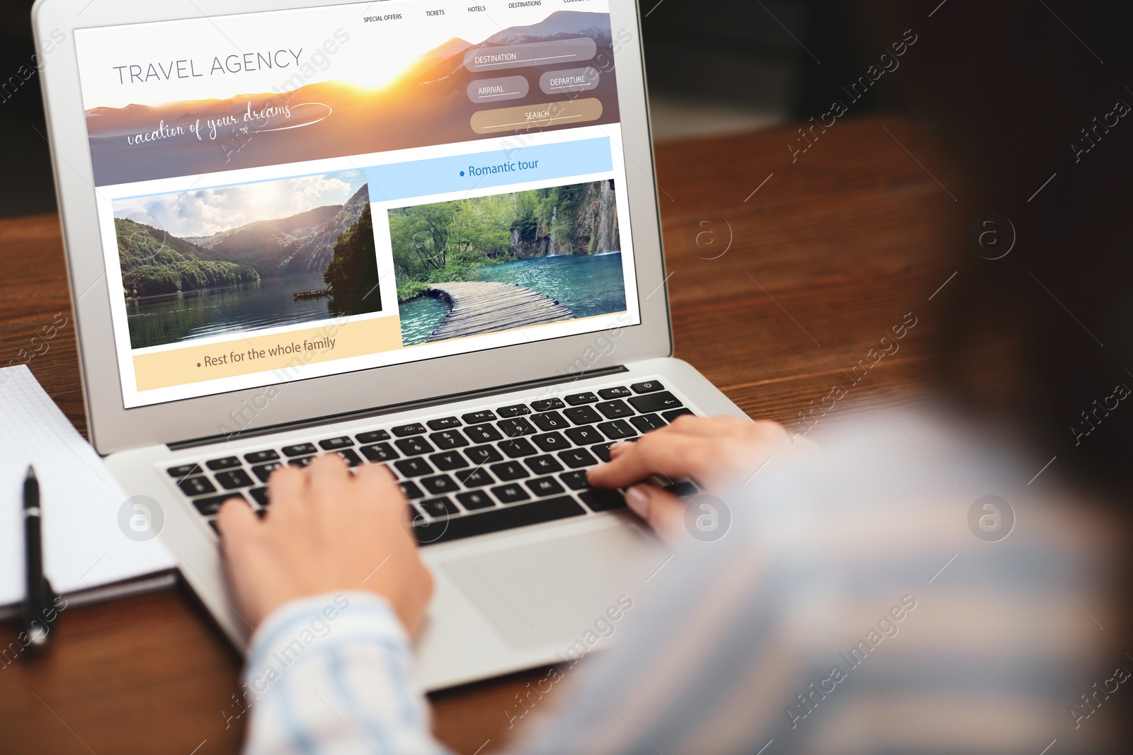 Image of Woman using laptop to plan trip, closeup. Travel agency website