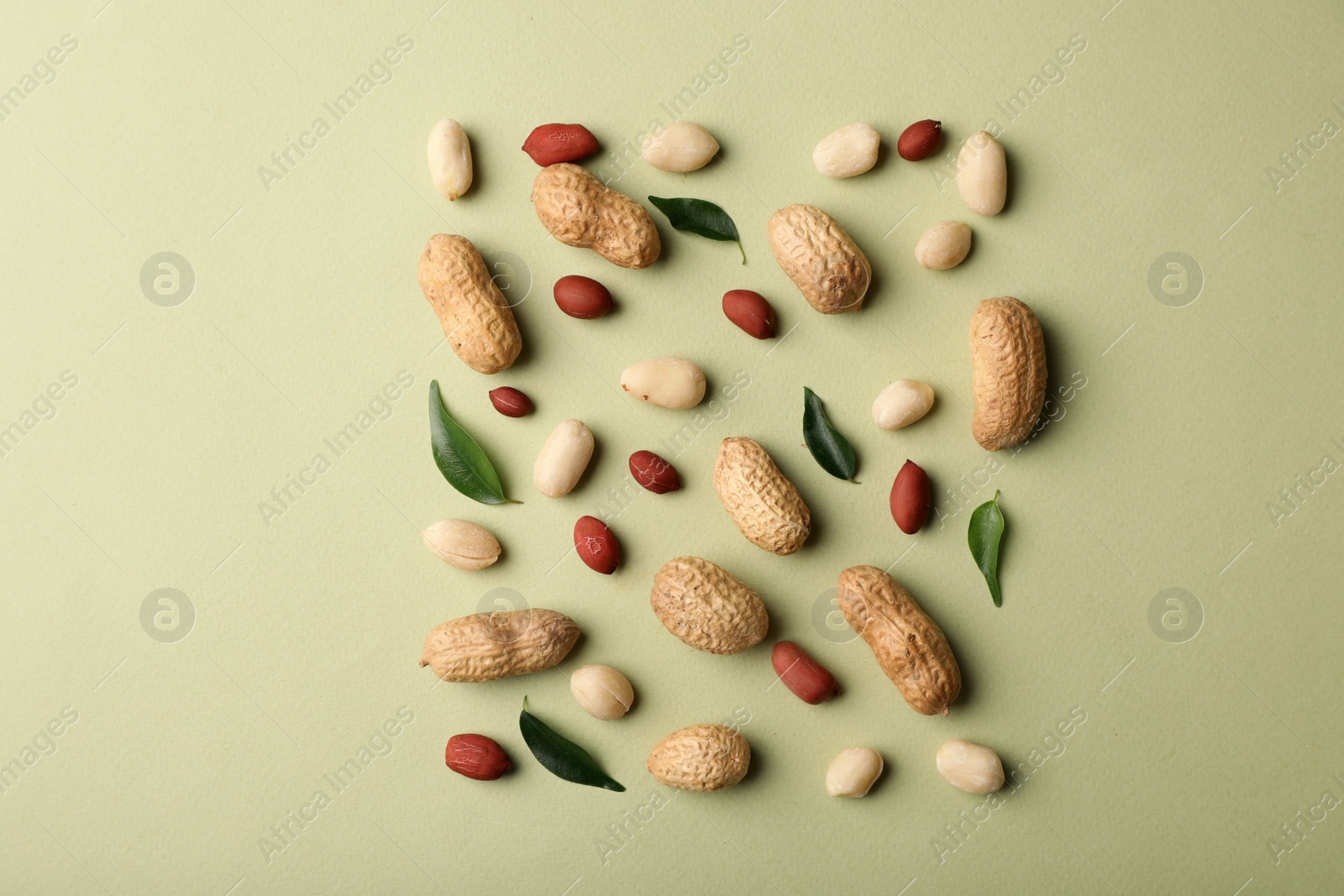 Photo of Composition with peanuts on color background, top view