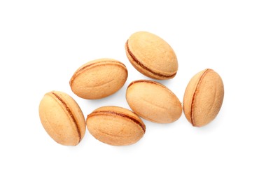 Photo of Delicious nut shaped cookies with boiled condensed milk on white background, top view