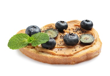 Tasty toast with blueberries, peanut butter and chia seeds on white background