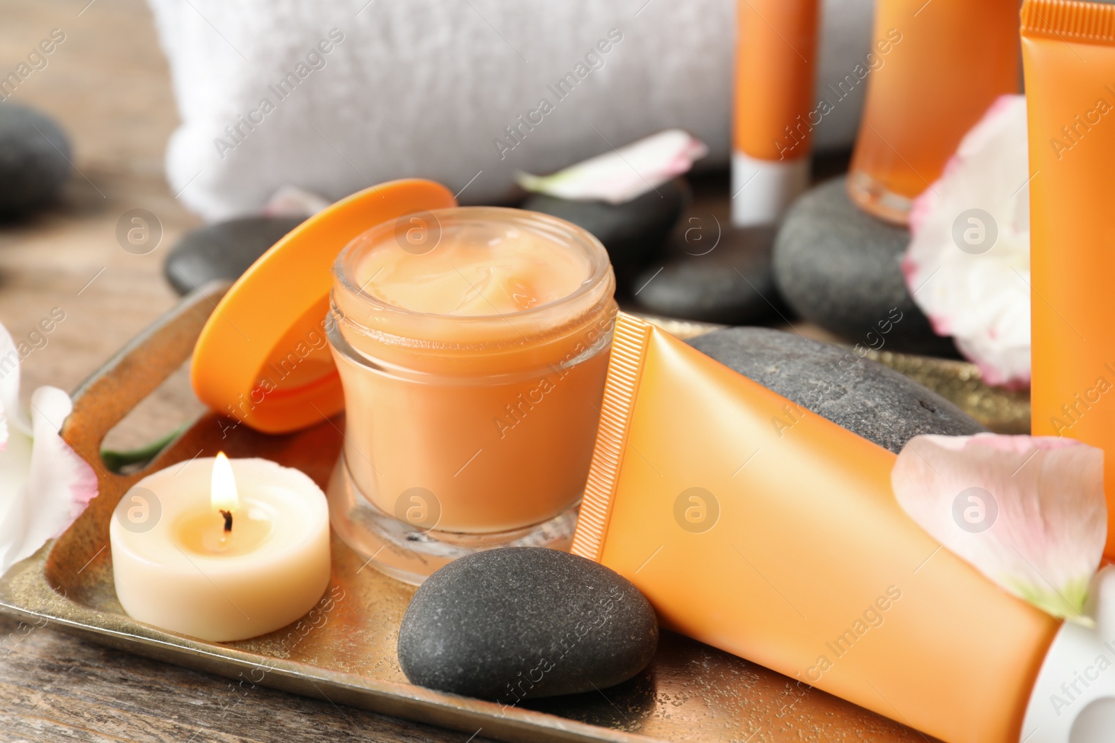 Photo of Composition with cosmetic products on wooden table, closeup