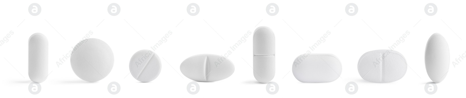 Image of Set of different pills in row isolated on white