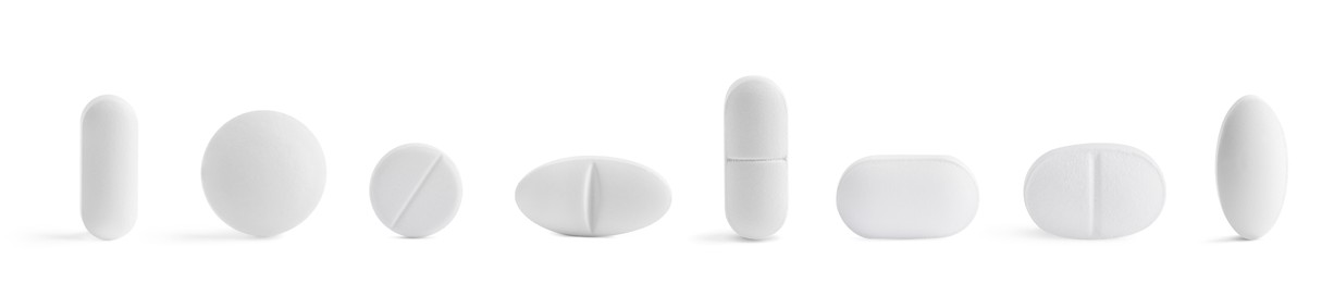 Image of Set of different pills in row isolated on white