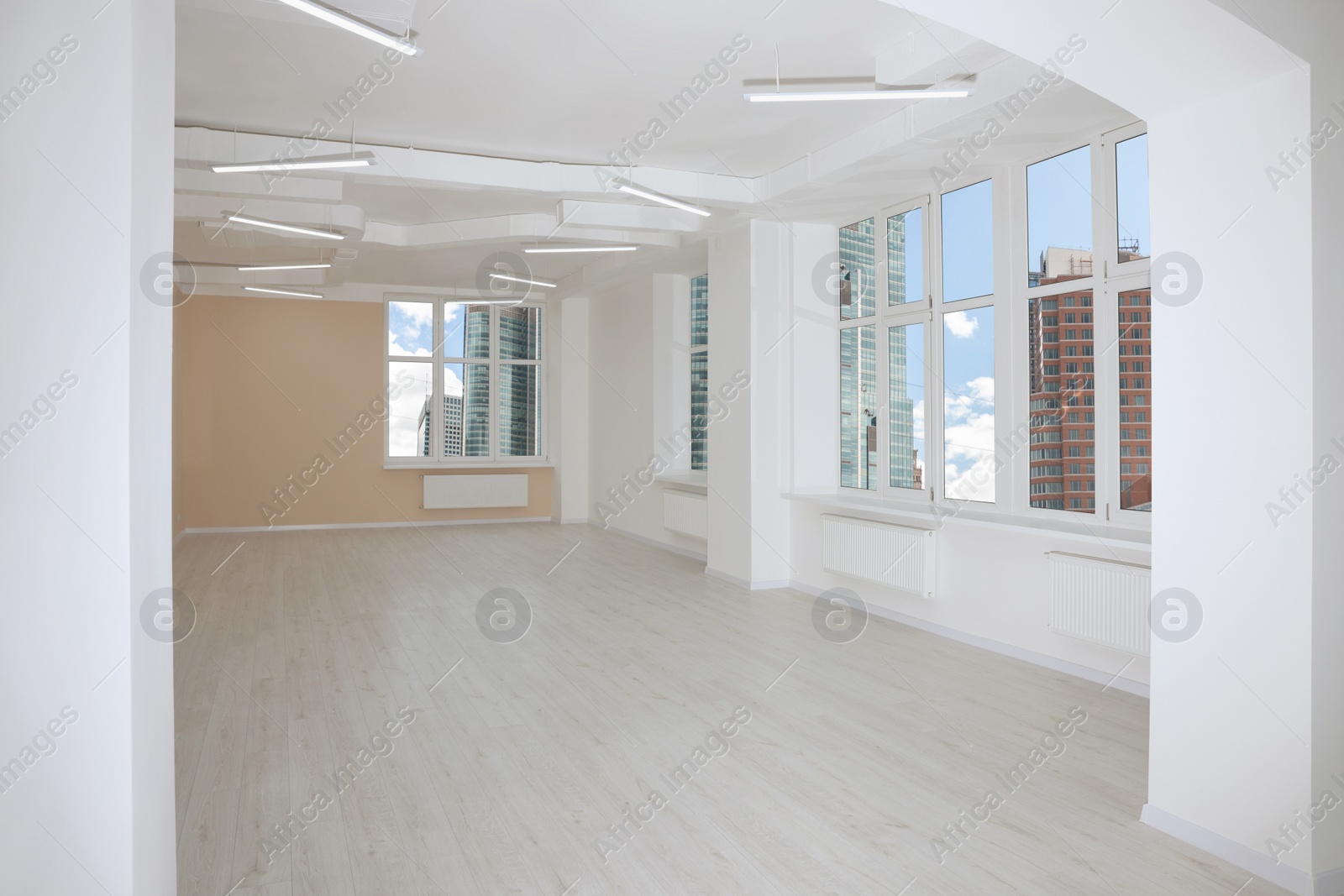 Photo of New empty room with clean windows and light walls