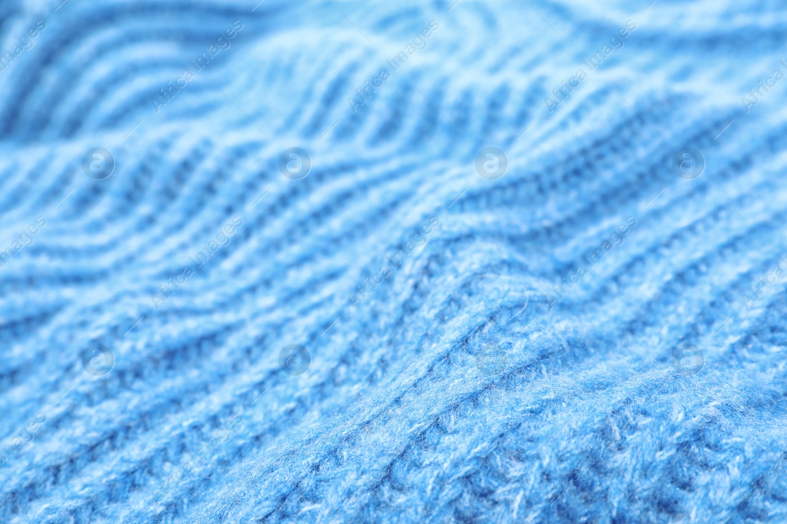 Photo of Texture of cozy warm sweater as background, closeup