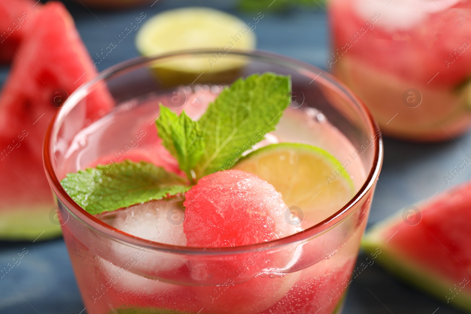 Photo of Glass of delicious refreshing watermelon drink, closeup