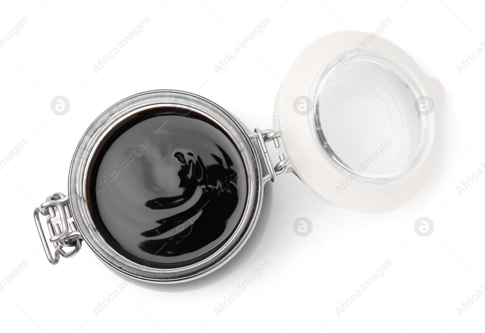 Photo of Glass jar with balsamic glaze isolated on white, top view