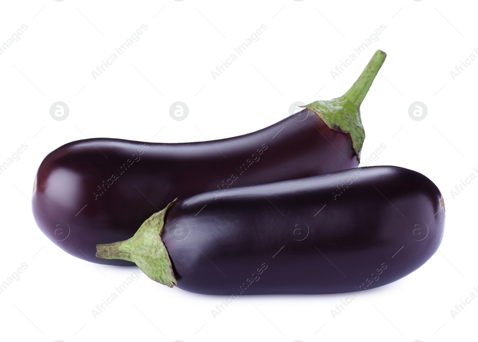 Photo of Tasty raw ripe eggplants isolated on white