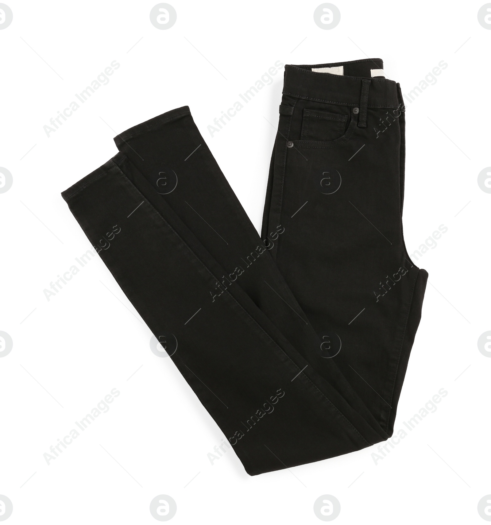 Photo of Folded black jeans isolated on white, top view