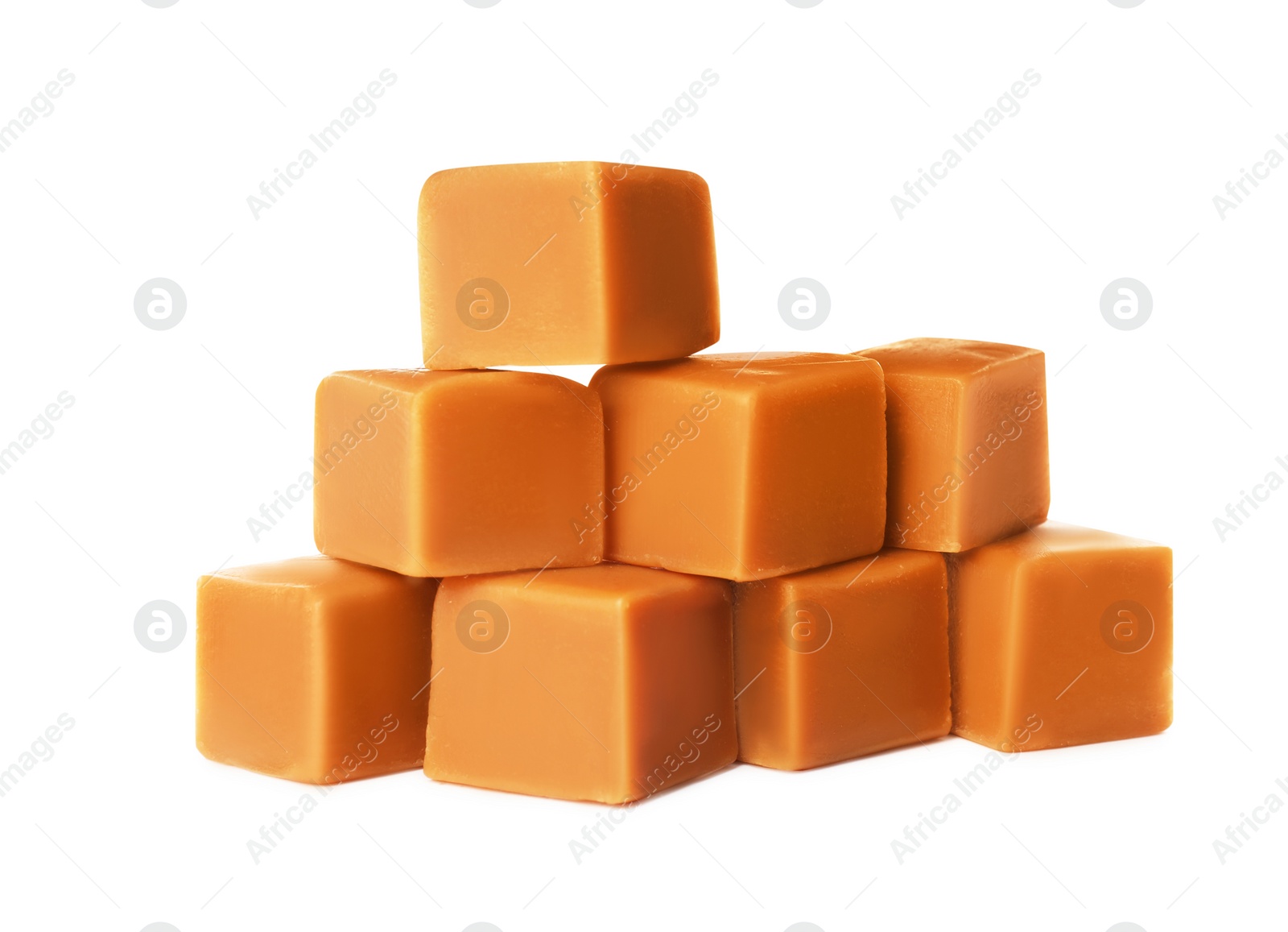 Photo of Heap of caramel candies on white background