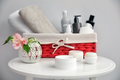 Set of body care cosmetics on table