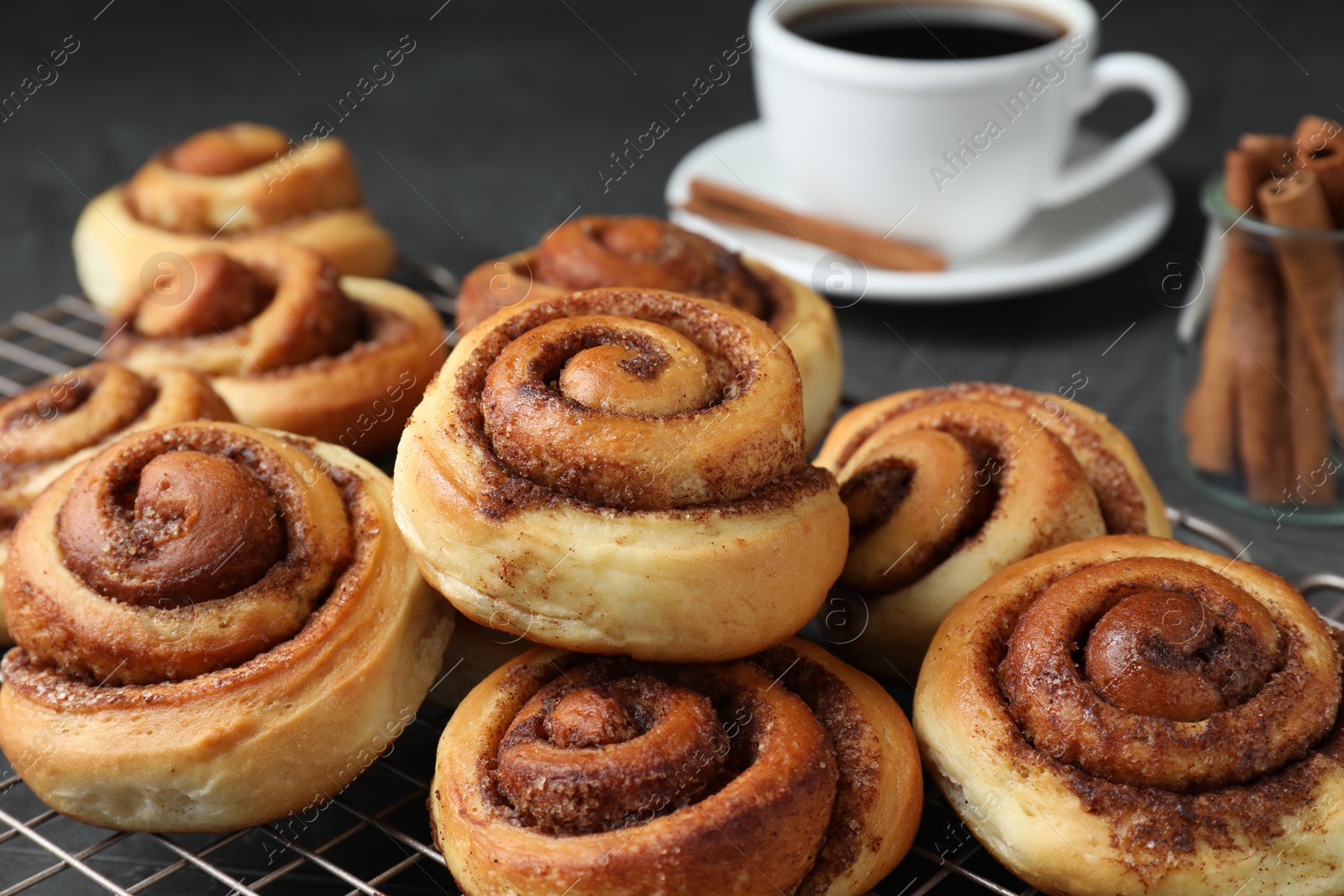 Photo of Tasty cinnamon rolls on table, closeup view