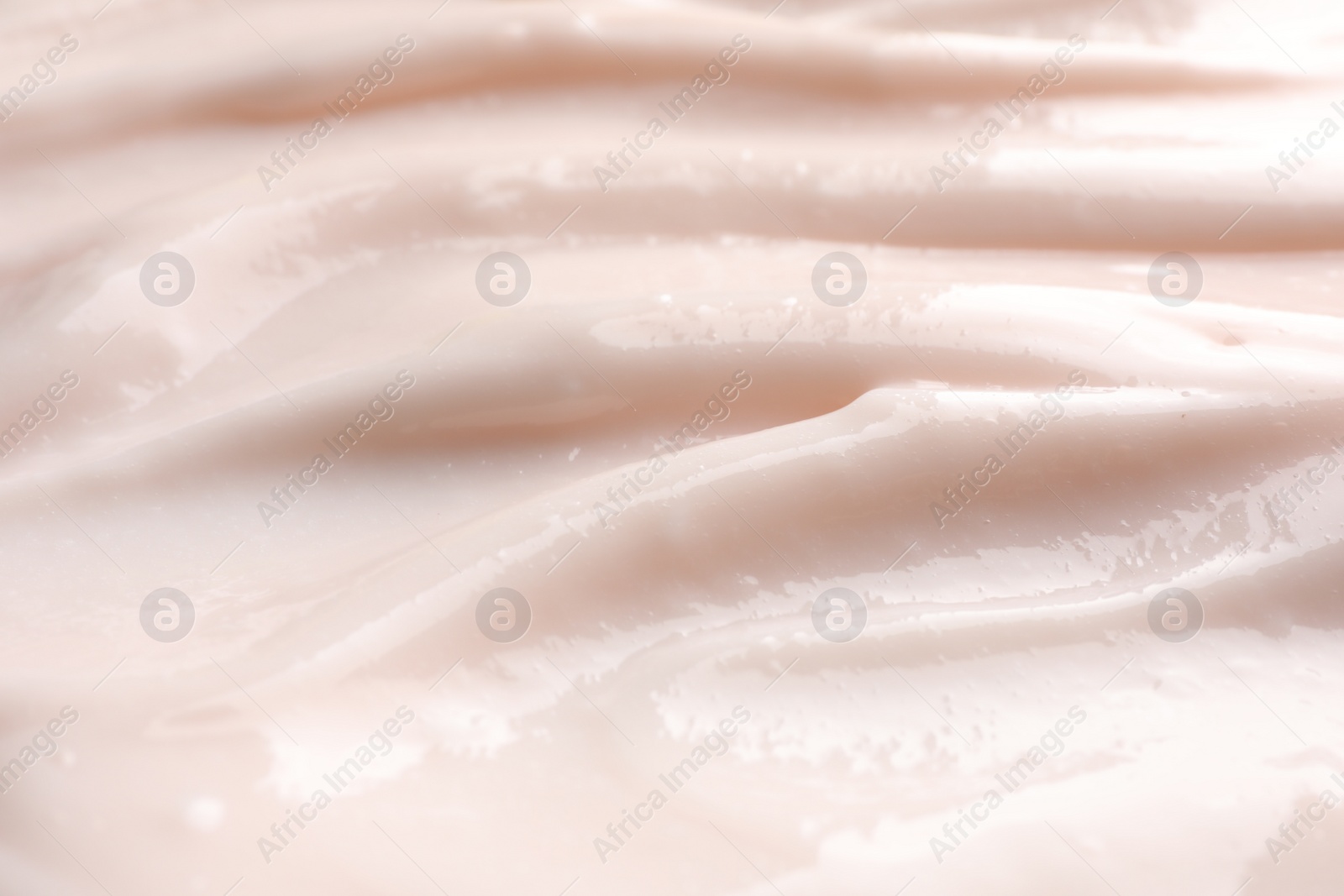 Photo of Texture of face cream as background, closeup view