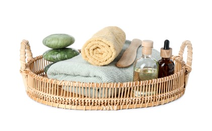 Spa composition. Towels, cosmetic products, stones and wooden spatula on white background