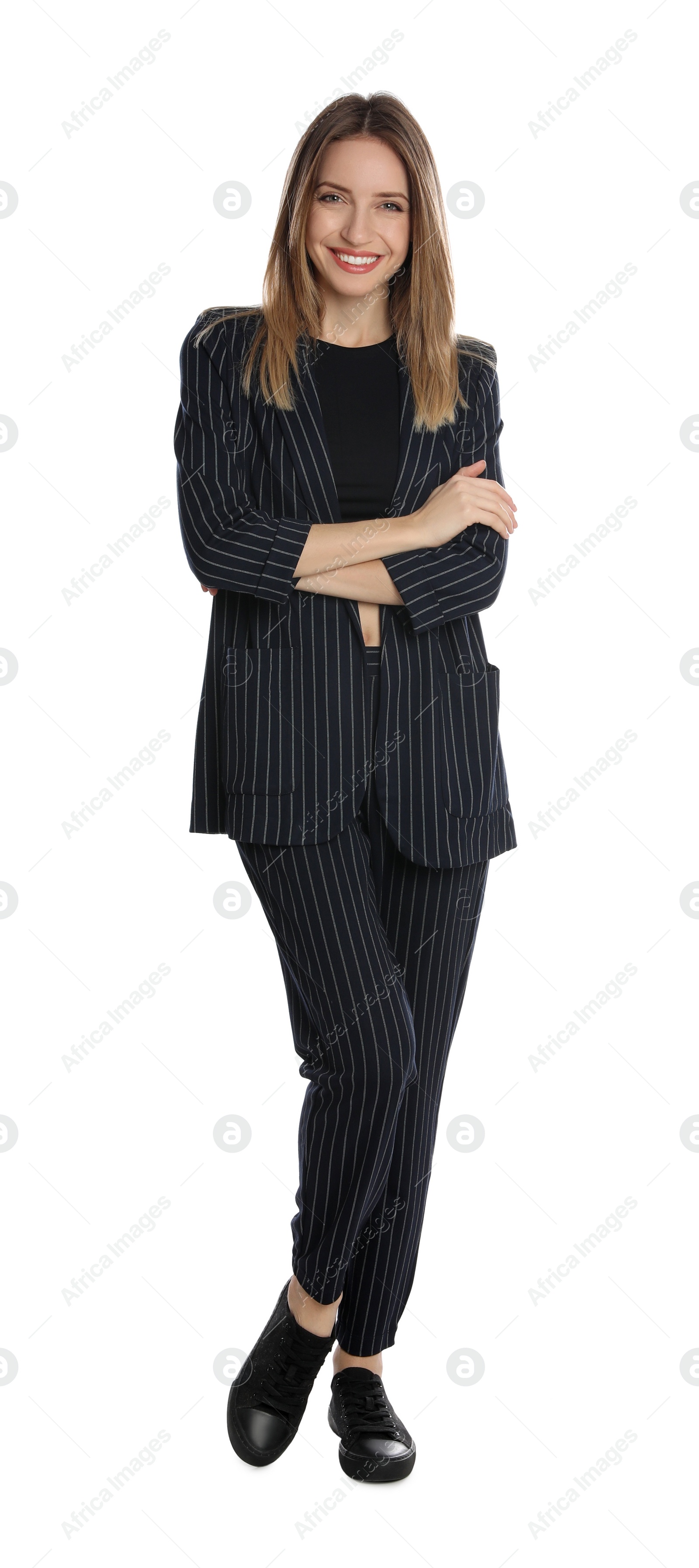 Photo of Full length portrait of beautiful young woman in fashionable suit on white background. Business attire