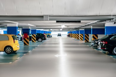 Photo of Clean parking garage with cars and lights