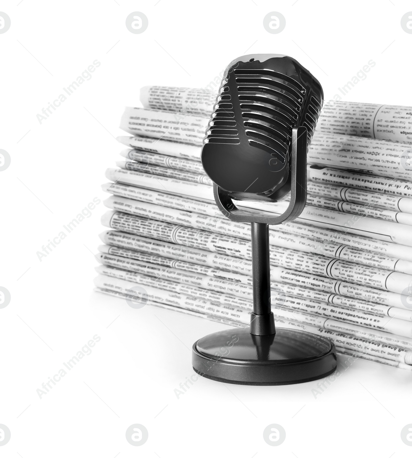 Photo of Newspapers and vintage microphone isolated on white. Journalist's work