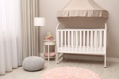 Modern baby room interior with stylish crib