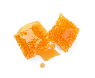 Photo of Natural honeycombs with tasty honey isolated on white, top view