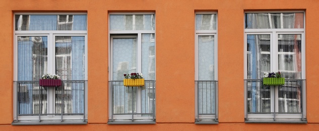 Photo of Colorful modern building with windows. Urban architecture