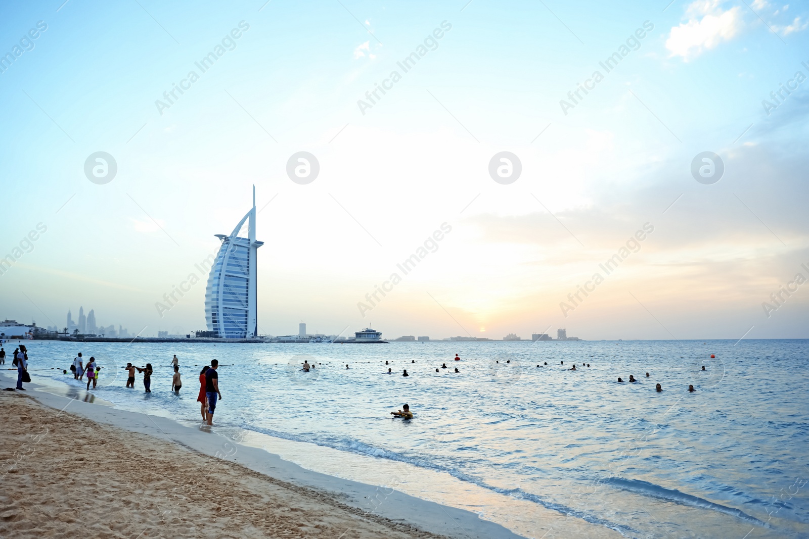 Photo of DUBAI, UNITED ARAB EMIRATES - NOVEMBER 03, 2018: Beautiful view of famous Burj Al Arab and sunset sky