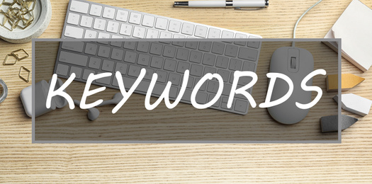 Image of Text KEYWORDS over modern workplace with keyboard and stationery, flat lay. Banner design