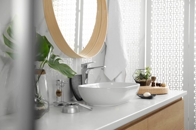 Photo of Stylish bathroom interior with vessel sink and mirror