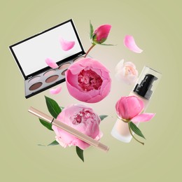 Image of Spring flowers and makeup products in air on light olive color background