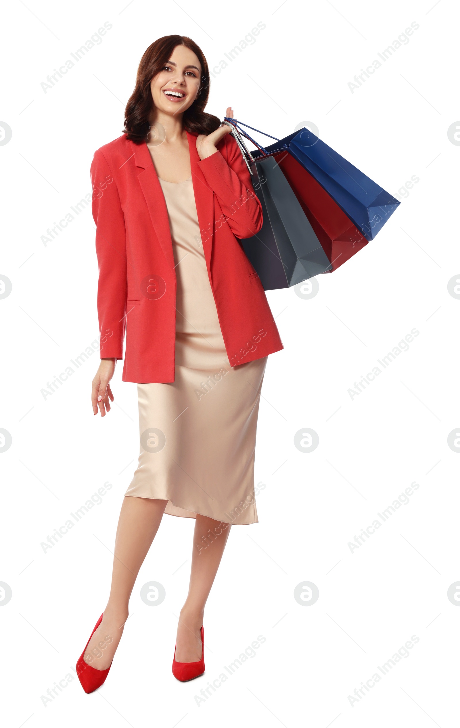 Photo of Beautiful young woman with paper shopping bags on white background