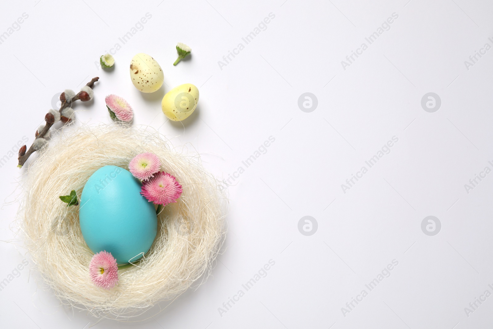 Photo of Flat lay composition with Easter eggs on white background. Space for text