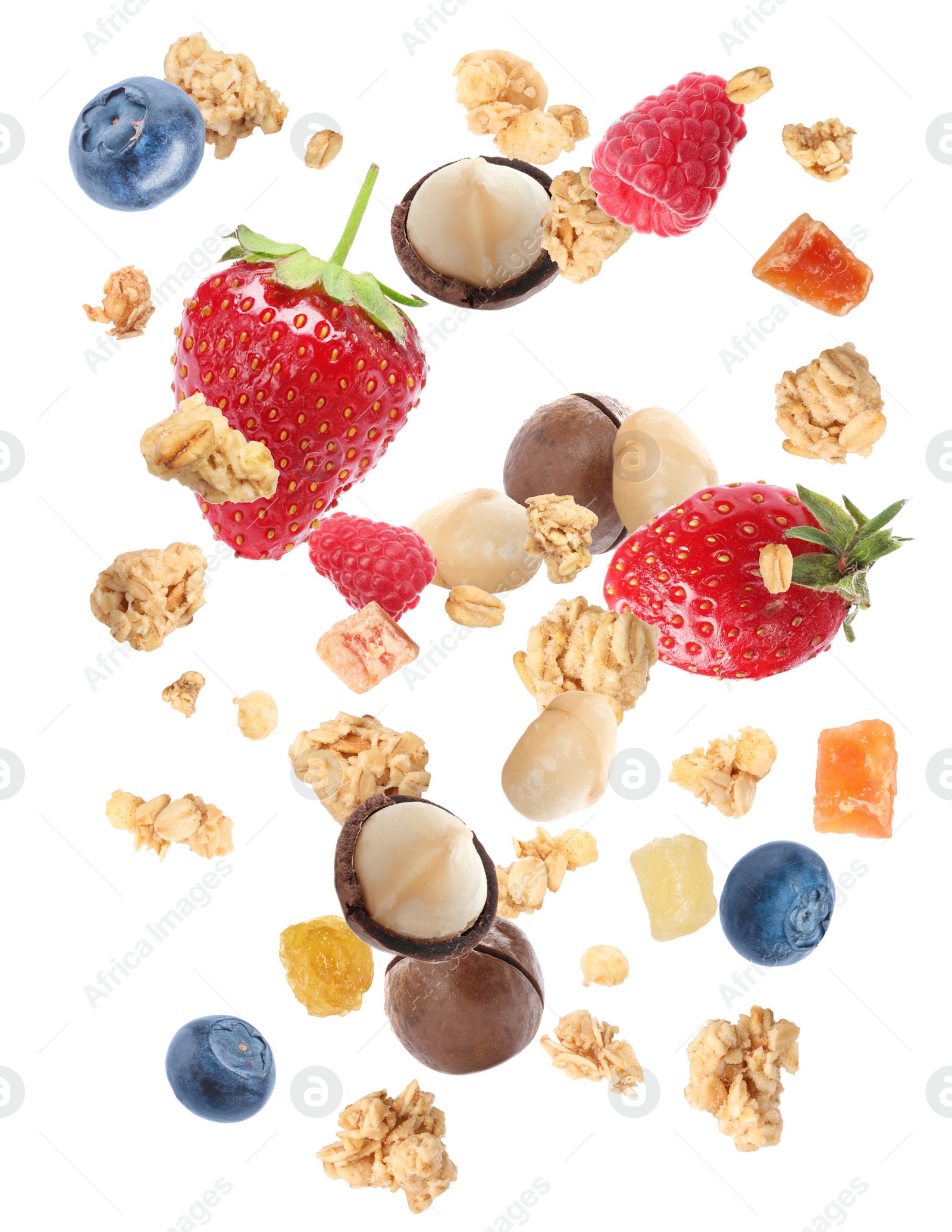 Image of Delicious granola, nuts and berries falling on white background. Healthy snack 