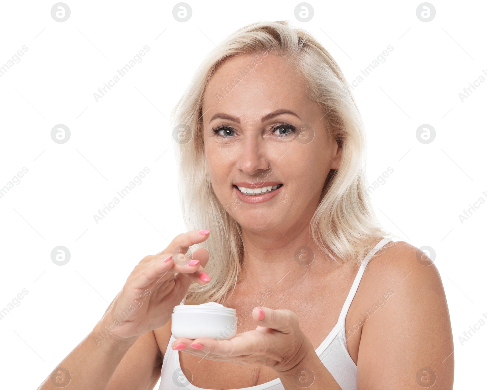 Photo of Portrait of beautiful mature woman with perfect skin holding jar of cream on white background