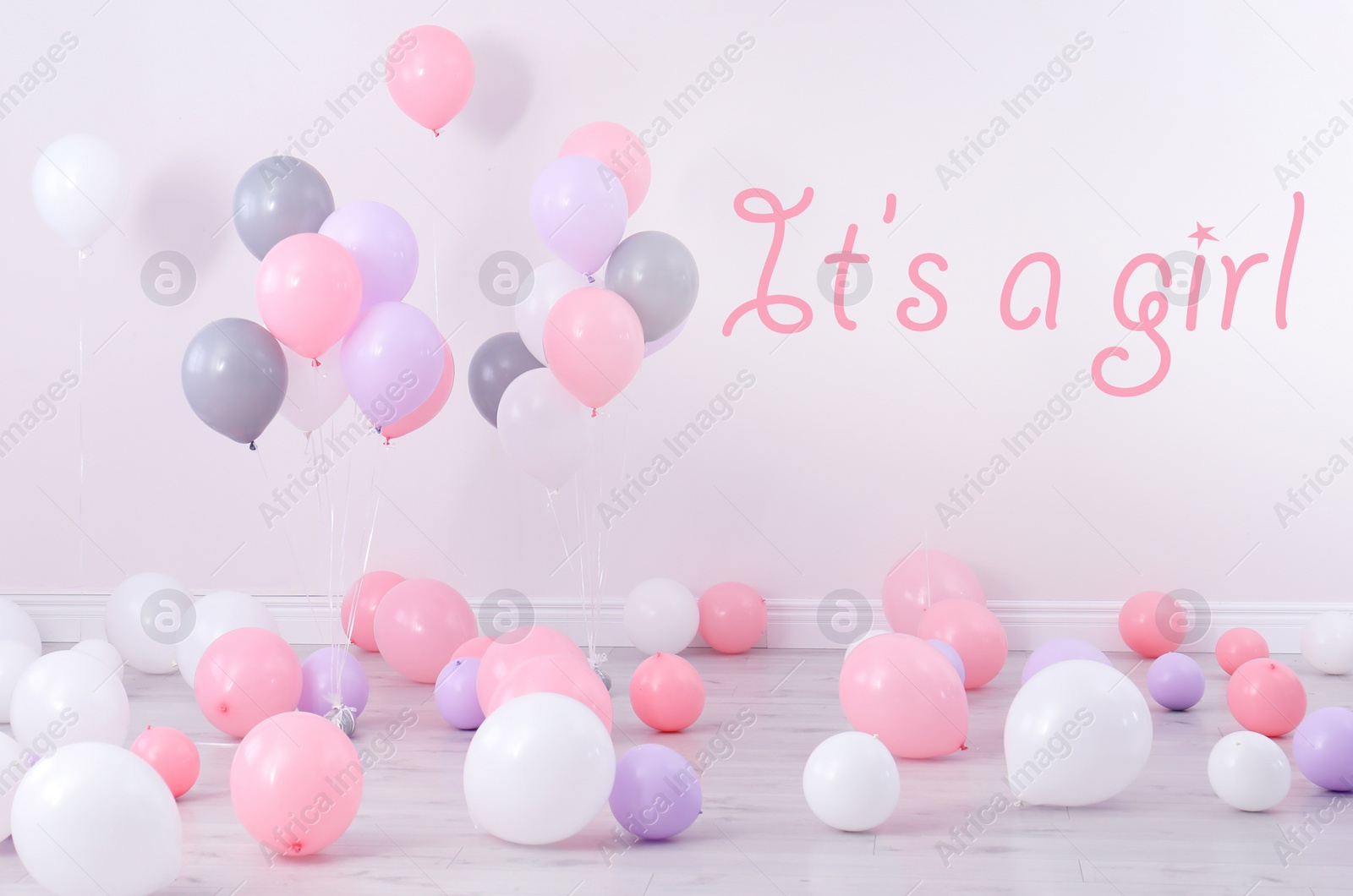 Image of Baby shower party for girl. Room decorated with balloons