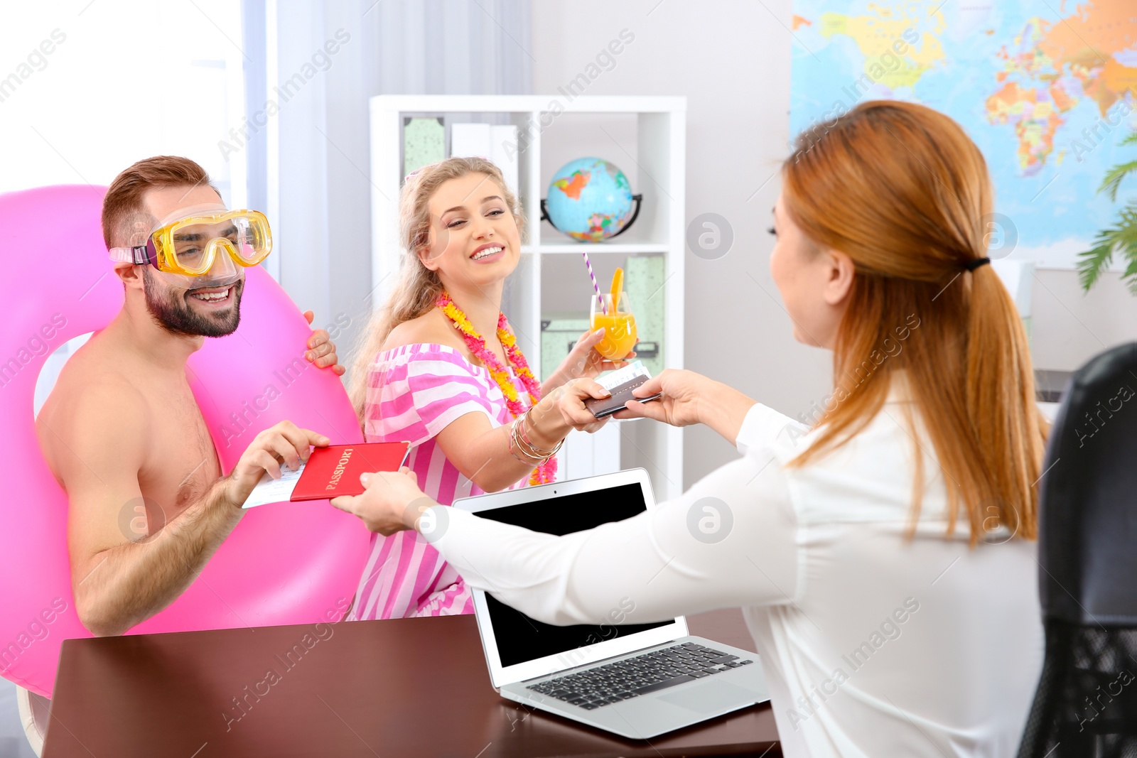 Photo of Beautiful young couple visiting travel agency office