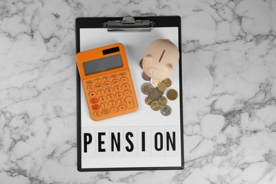 Photo of Calculator, piggy bank, coins and clipboard with word Pension on white marble table, top view. Retirement concept