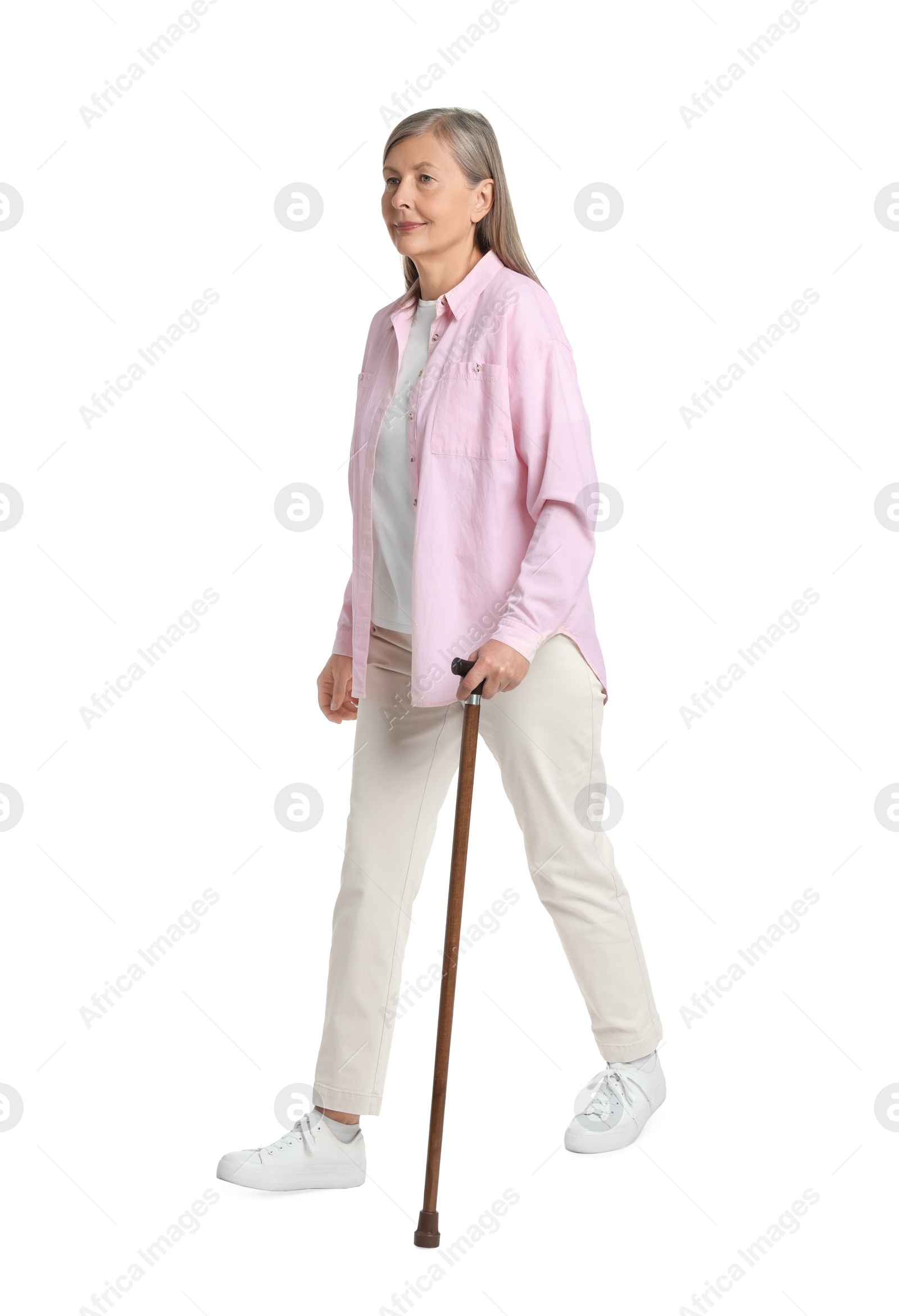 Photo of Senior woman with walking cane on white background