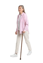 Senior woman with walking cane on white background