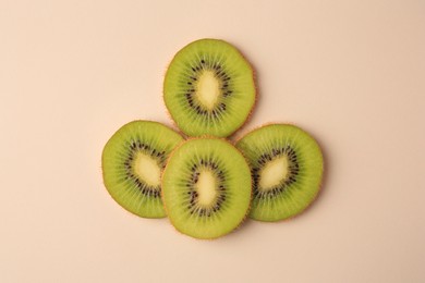 Photo of Cut fresh ripe kiwis on white background, flat lay