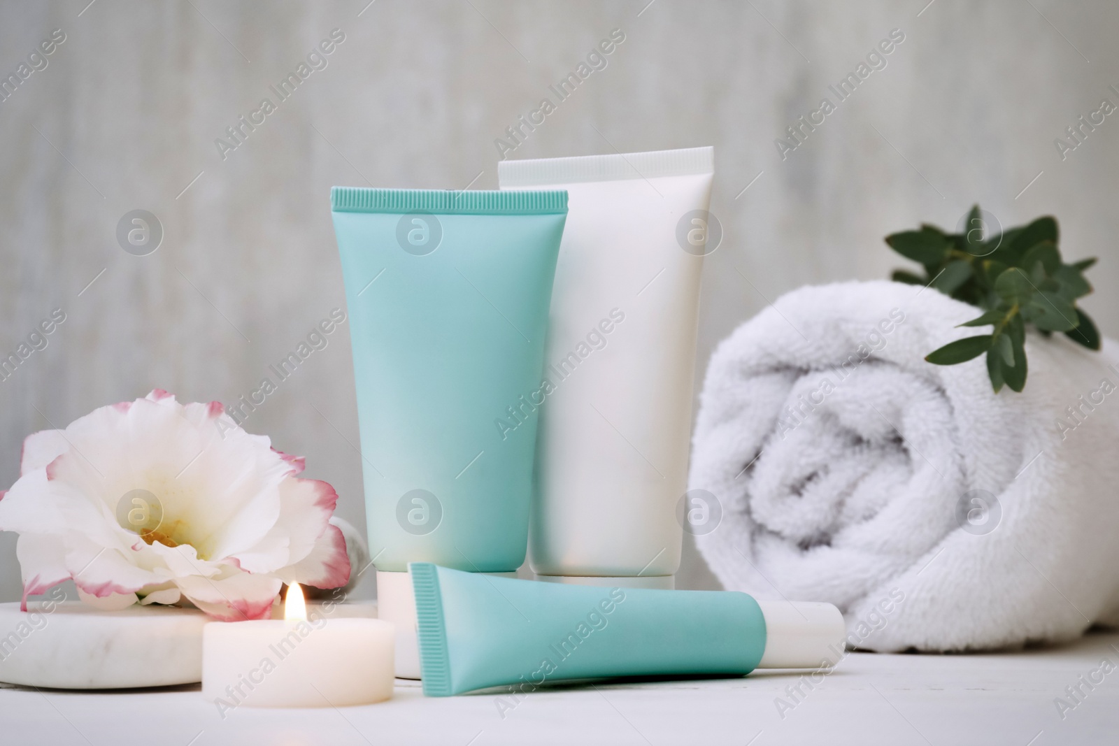 Photo of Composition with cosmetic products on white table