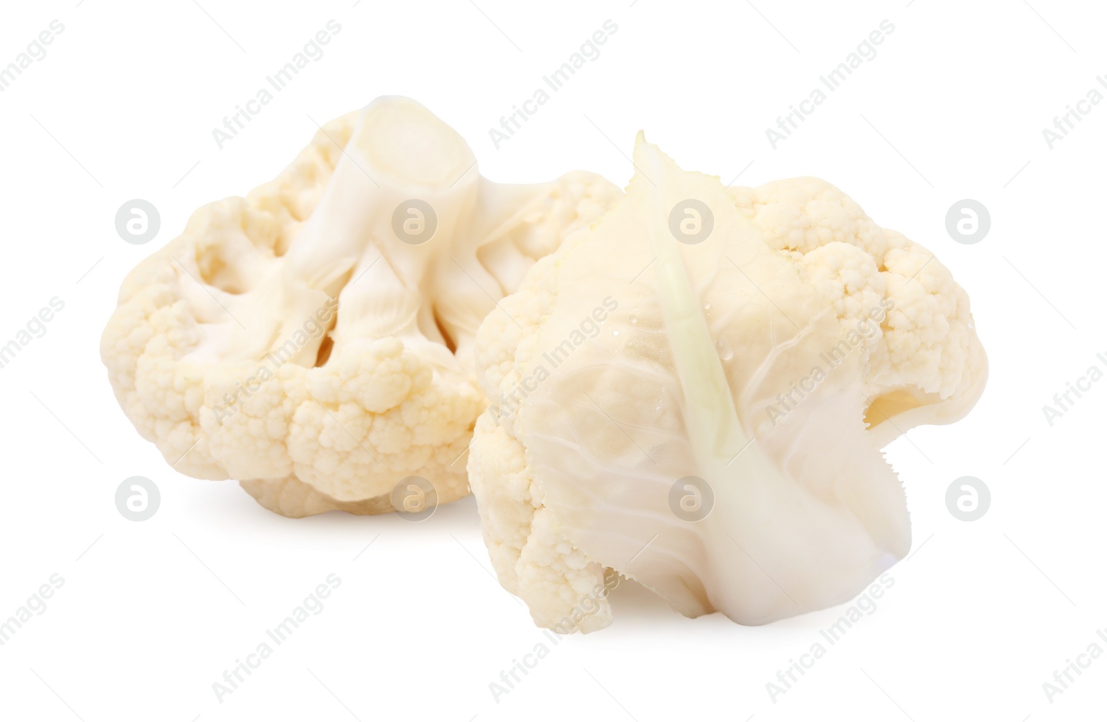Photo of Cut fresh raw cauliflowers on white background