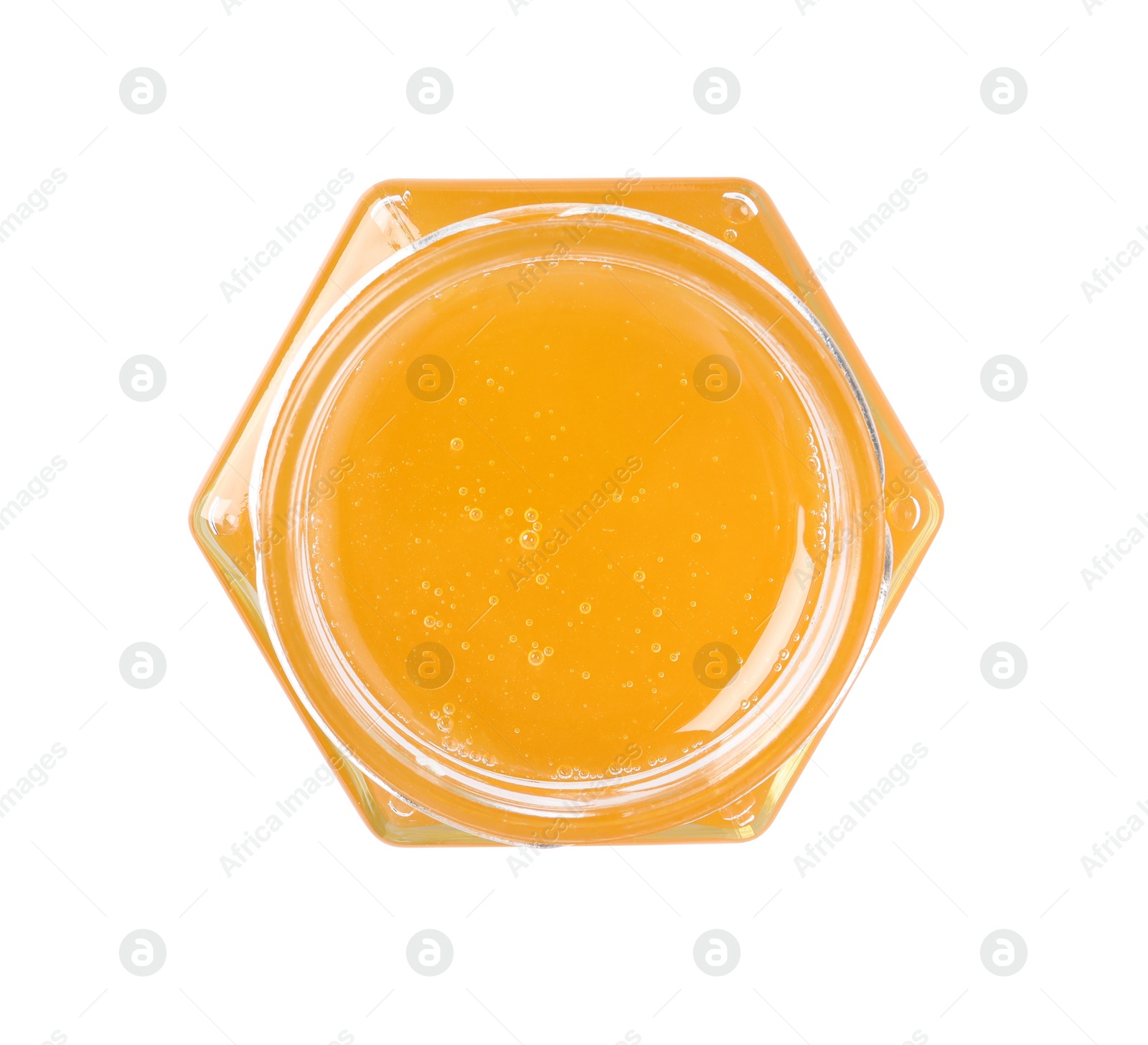 Photo of Tasty honey in glass jar isolated on white, top view