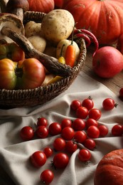 Photo of Different fresh ripe vegetables and fruits on wooden table
