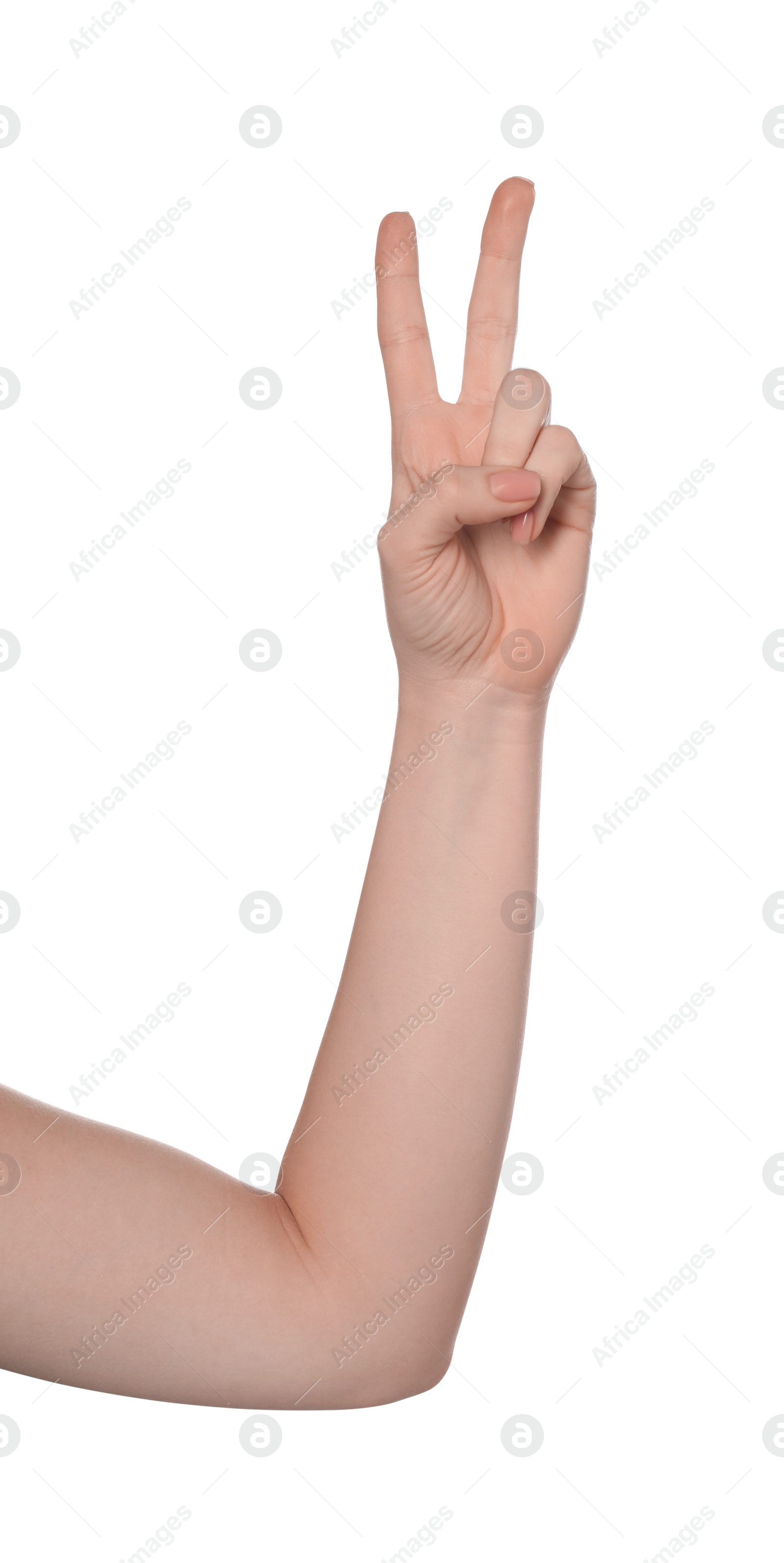 Photo of Playing rock, paper and scissors. Woman making scissors with her fingers on white background, closeup